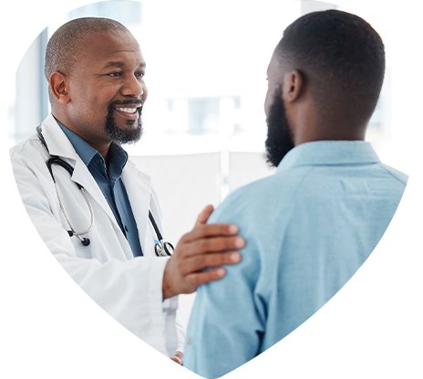 A doctor with his hand on his patient's shoulder, ensuring comfort and peace in his diagnosis.