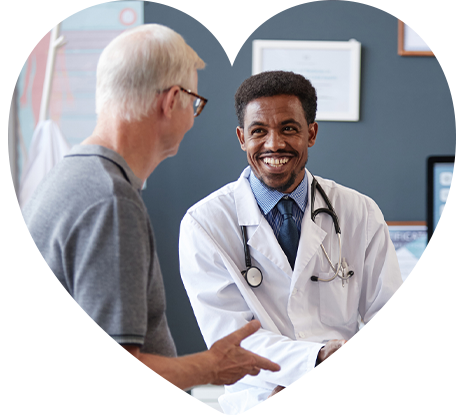 A doctor smiling at his patient.
