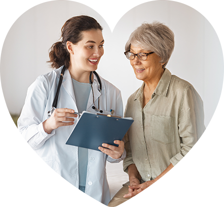 A doctor showing her notes to a patient.