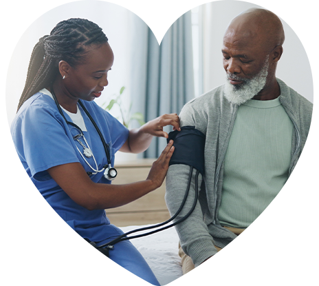 A nurse checking a patient’s blood pressure.