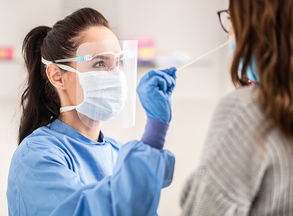 A doctor swabbing a patient for a virus test.