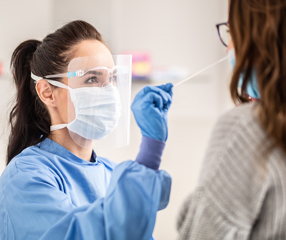 A doctor swabbing a patient for a virus test.